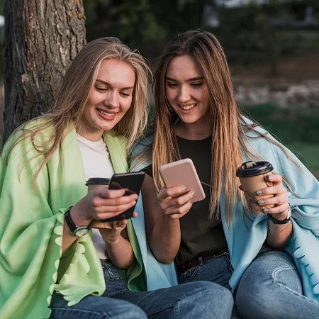 Two women enjoying spardo offers